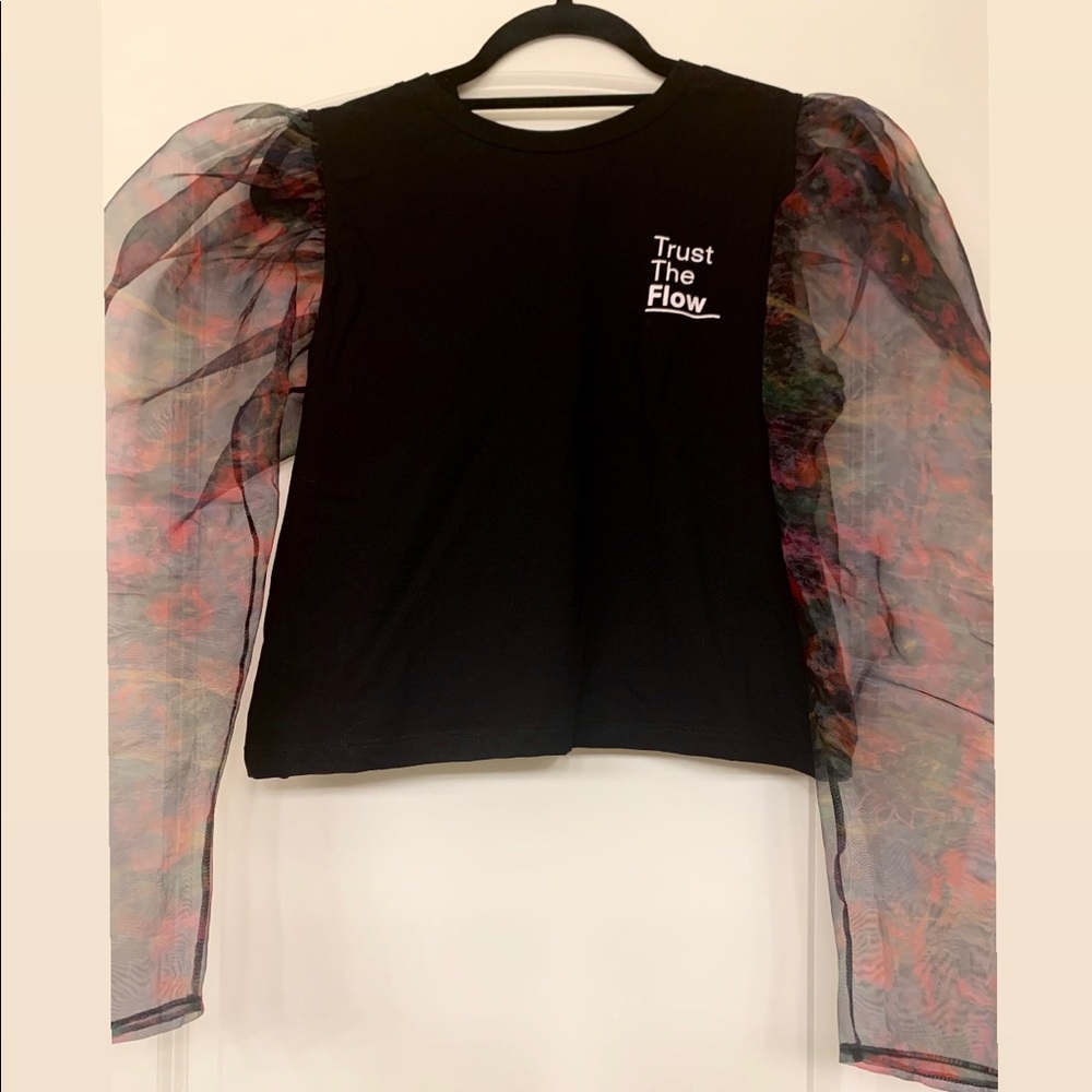 Top with contrast organza sleeves.
